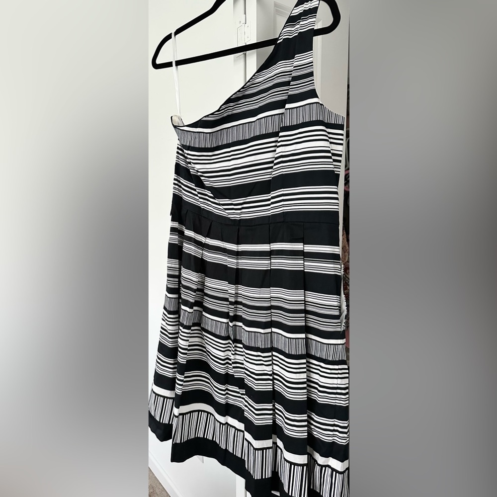 One shoulder pleated bottom black and white dress